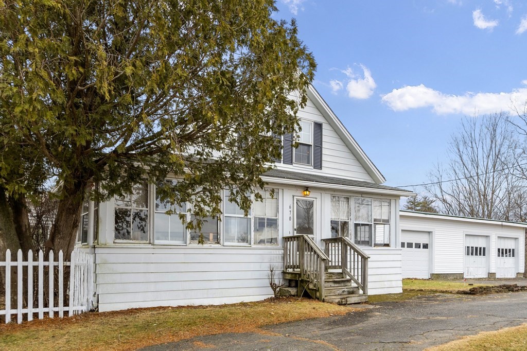 670 Brooks Road Athol, MA 01331 - Photo 2 of 36 a front view of a house with a tree
