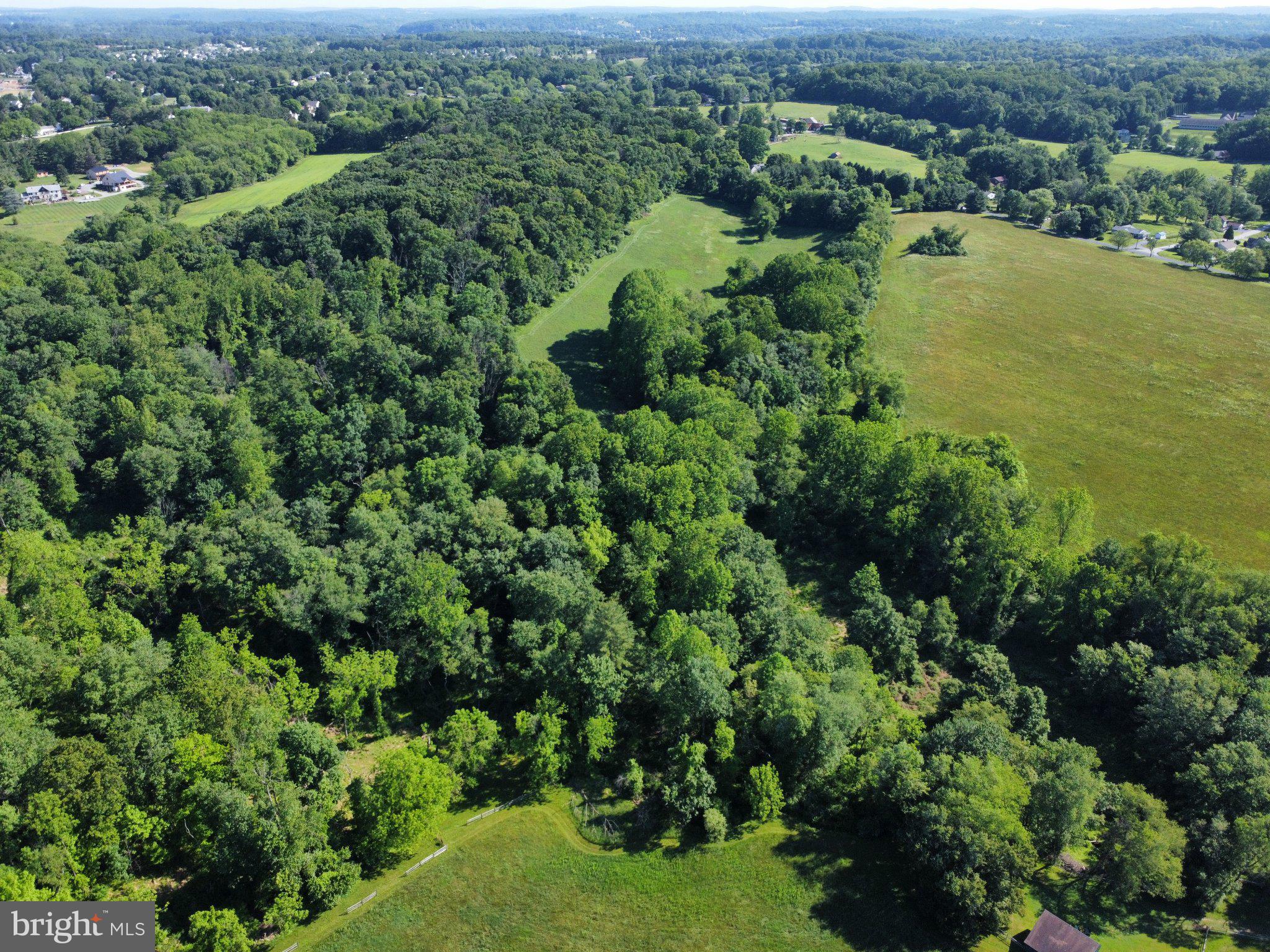 970 Doe Run Road East Fallowfield, PA 19320 - Photo 3 of 16 an aerial view of residential house with outdoor space and trees all around