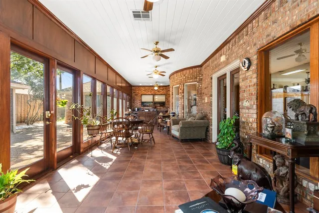 a bed room with furniture and a ceiling fan