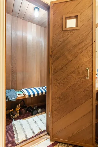 a bathroom with double sink and a mirror