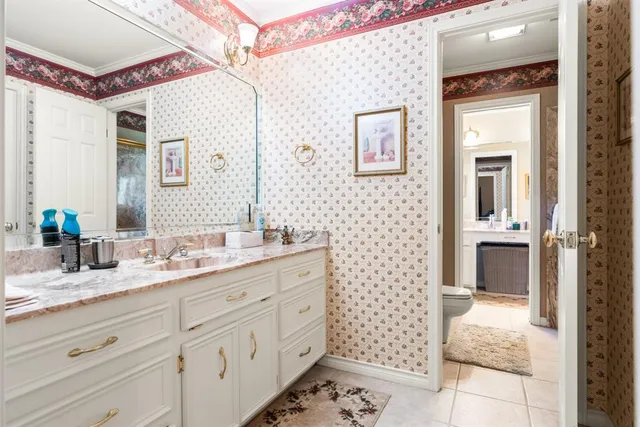 a bathroom with a double vanity sink mirror and a shower