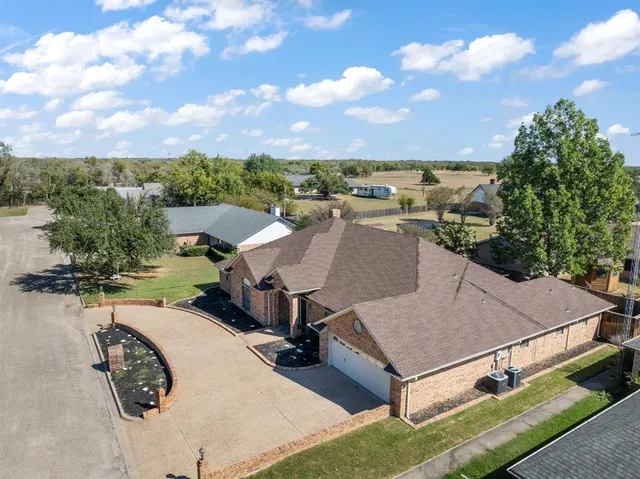 an aerial view of a house having yard