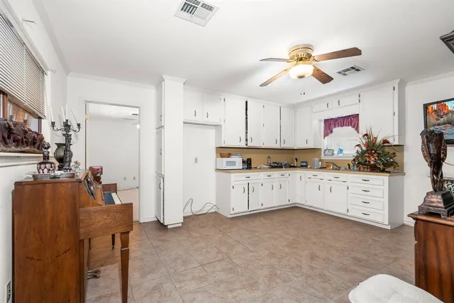 a view of a workspace with furniture and gym equipment