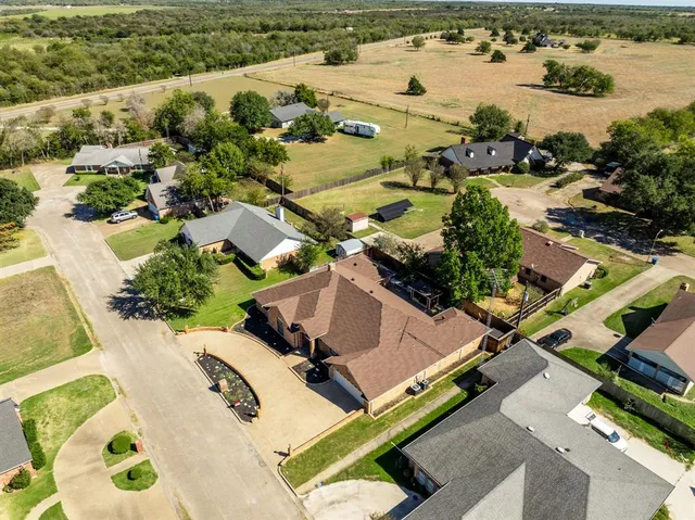 a view of a chair and tables in the patio