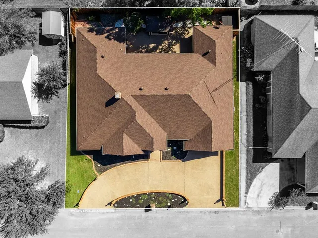 an aerial view of a house with swimming pool