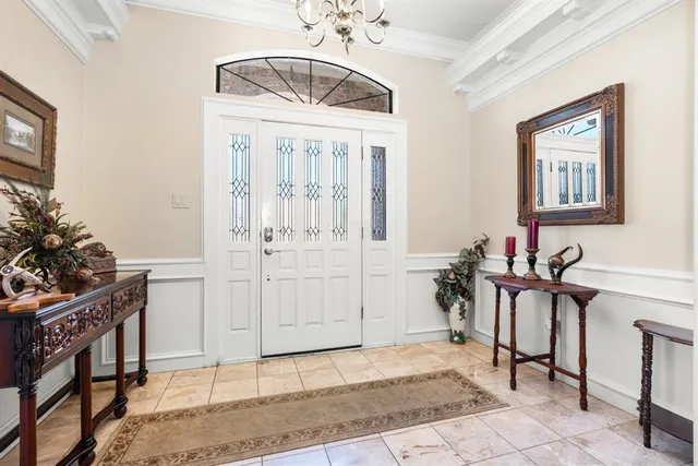 a living room with furniture a dining table and chairs with wooden floor
