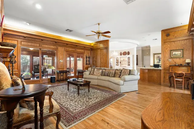 a living room with lots of furniture and a rug