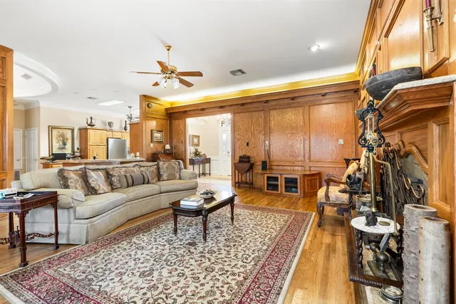 a view of living room with granite countertop kitchen island granite countertop furniture and a large window