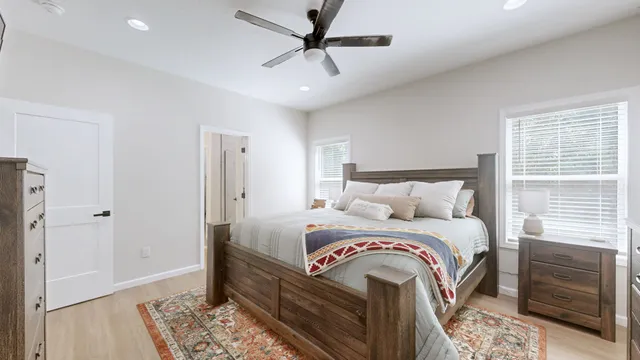 a bedroom with bed and a window