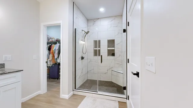 a bathroom with a glass shower door