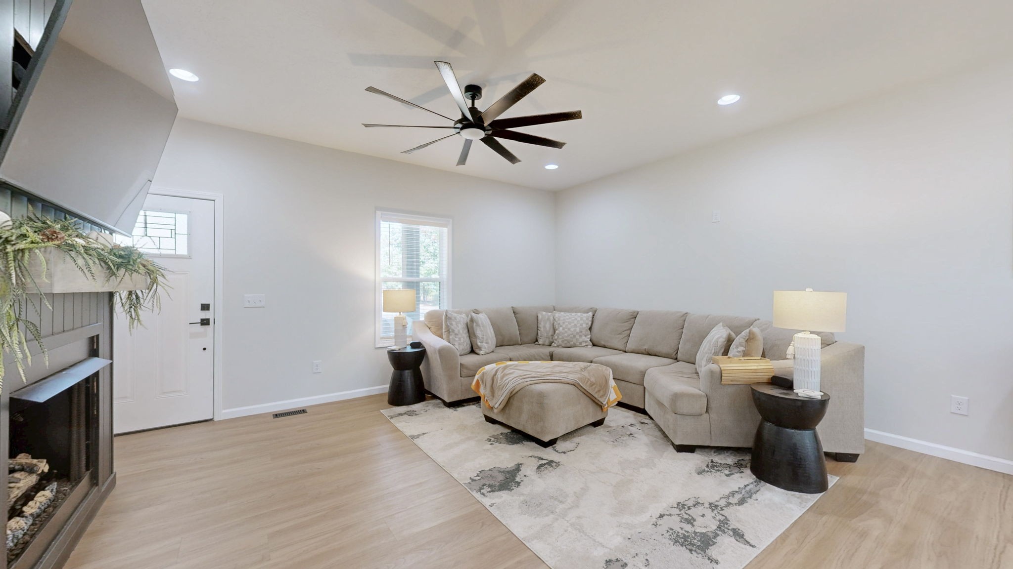 140 Jackson Forest Road Paris, TN 38242 - Photo 2 of 33 a living room with furniture and a fireplace