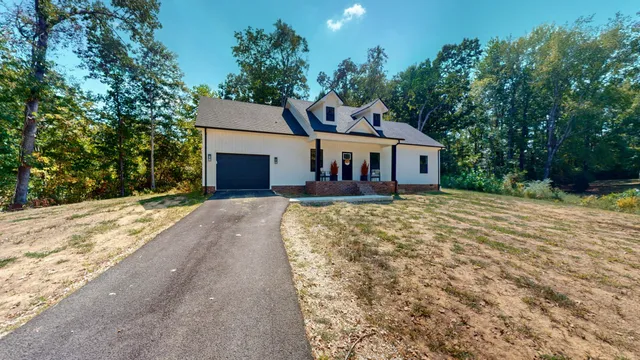 front view of a house with a yard