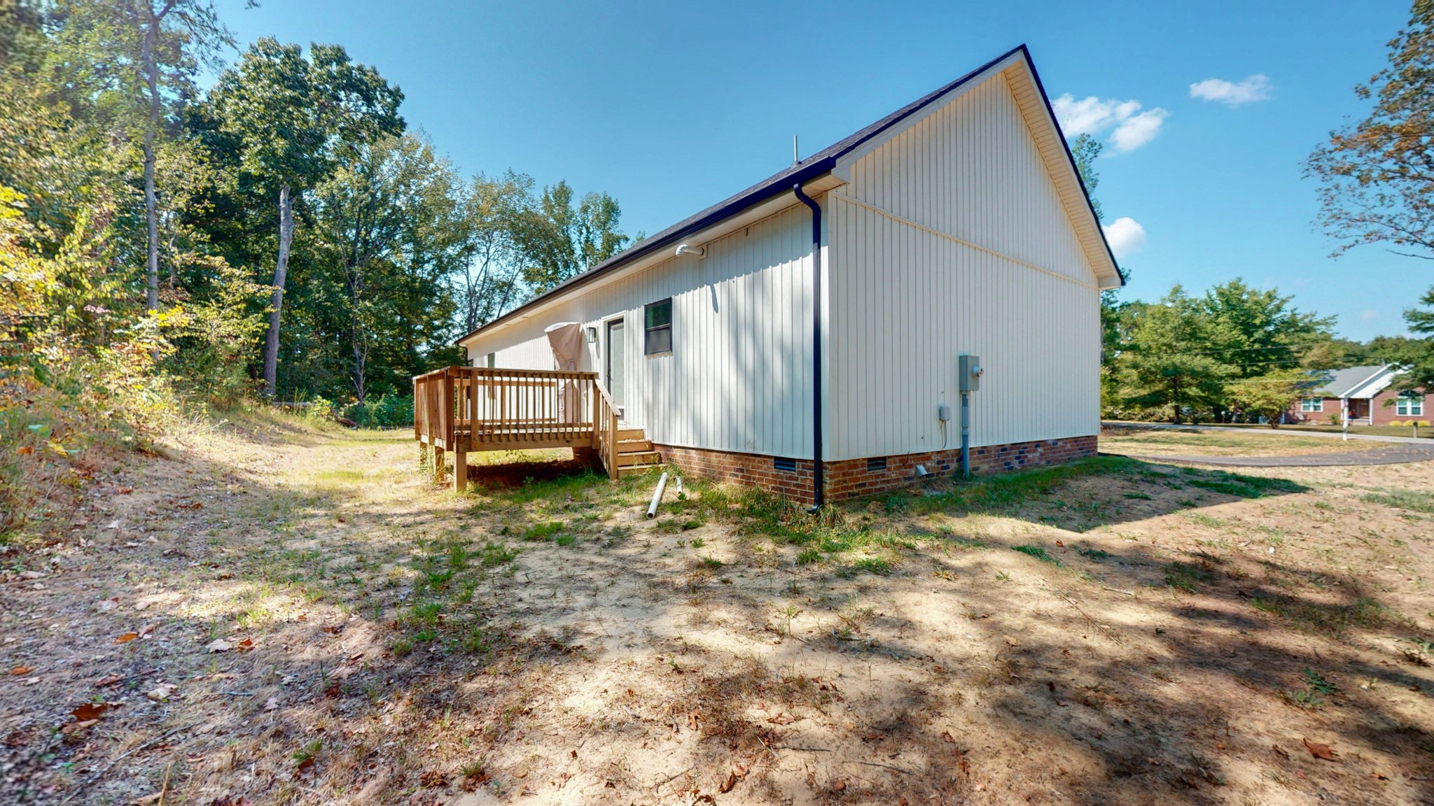 140 Jackson Forest Road Paris, TN 38242 - Photo 23 of 33 a view of a house with backyard and trees