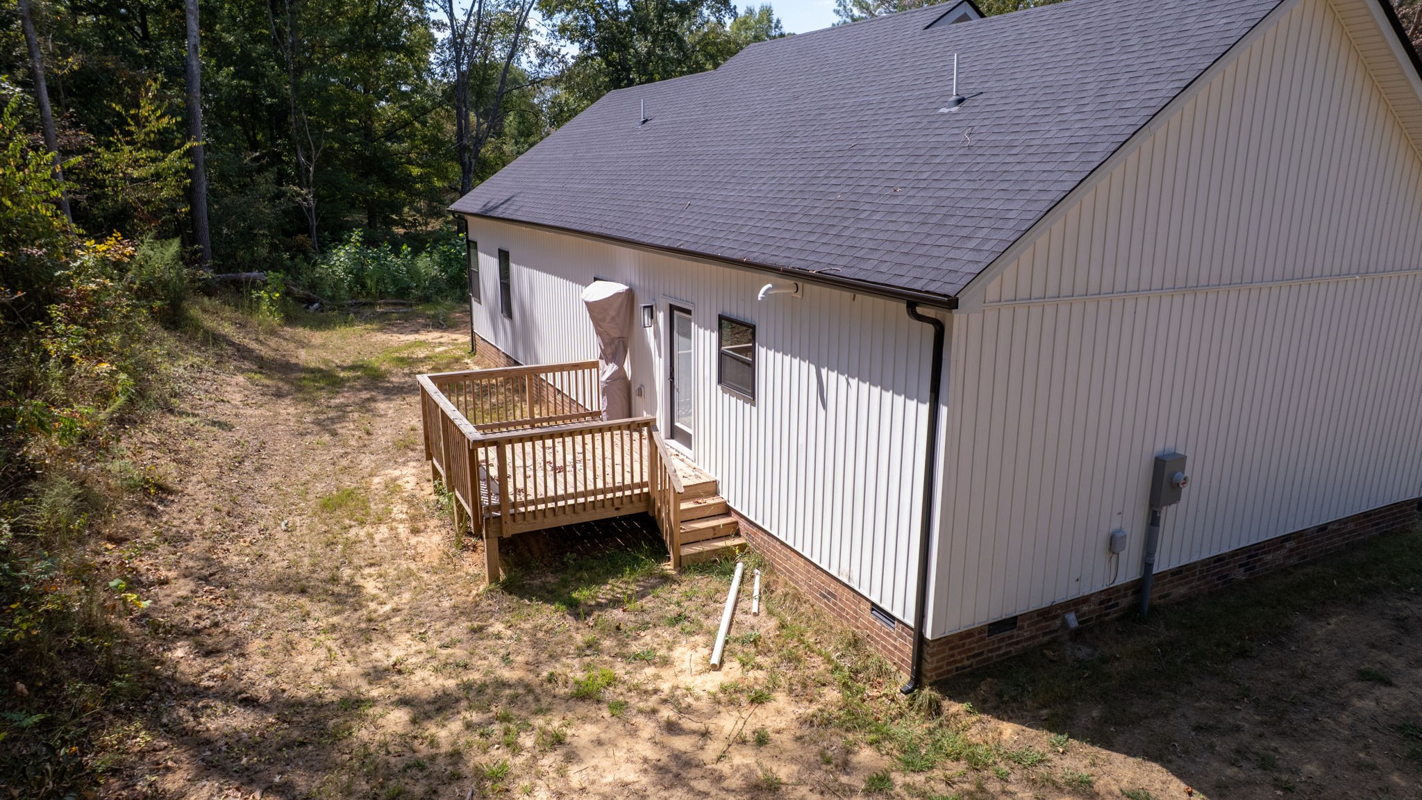 140 Jackson Forest Road Paris, TN 38242 - Photo 31 of 33 a view of a house with backyard and deck
