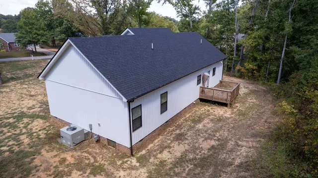 a aerial view of a house with yard and sitting area