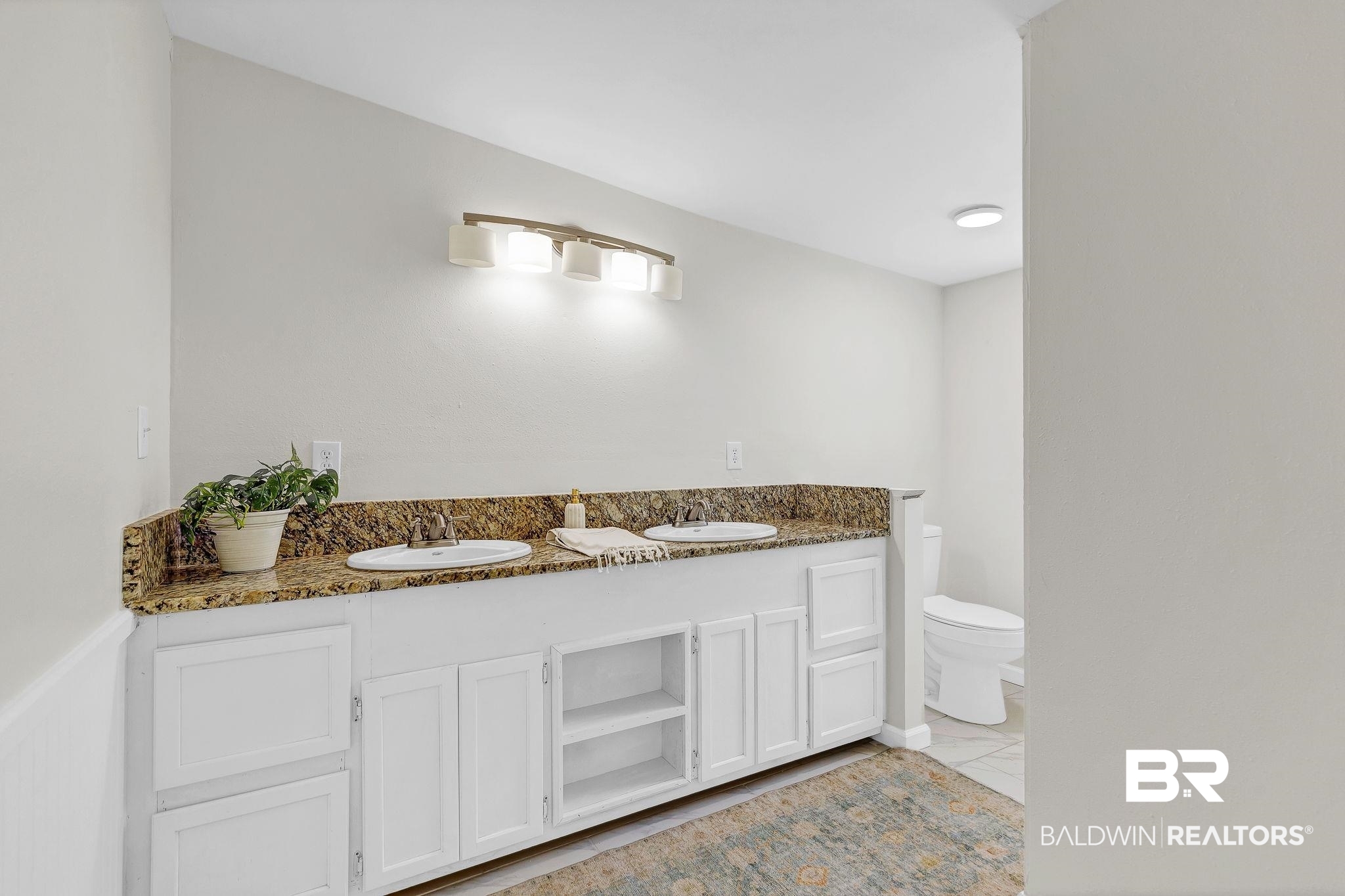 11964 Stroh Road Daphne, AL 36527 - Photo 39 of 58 Full bath with double vanity, a sink, and toilet