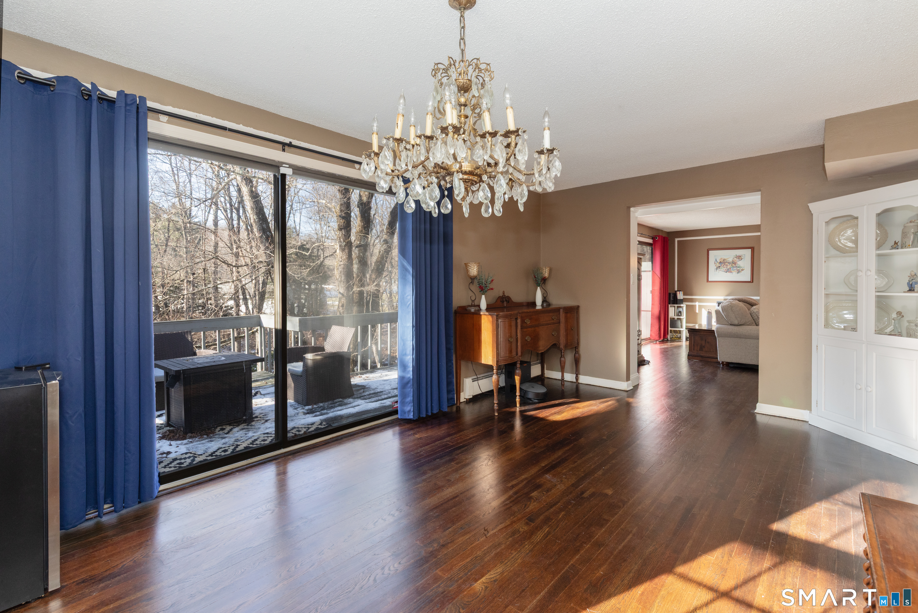 637 Watertown Road Middlebury, CT 06762 - Photo 14 of 40 a view of a room with wooden floor and a chandelier
