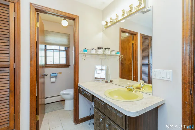 a bathroom with a sink double vanity and a mirror