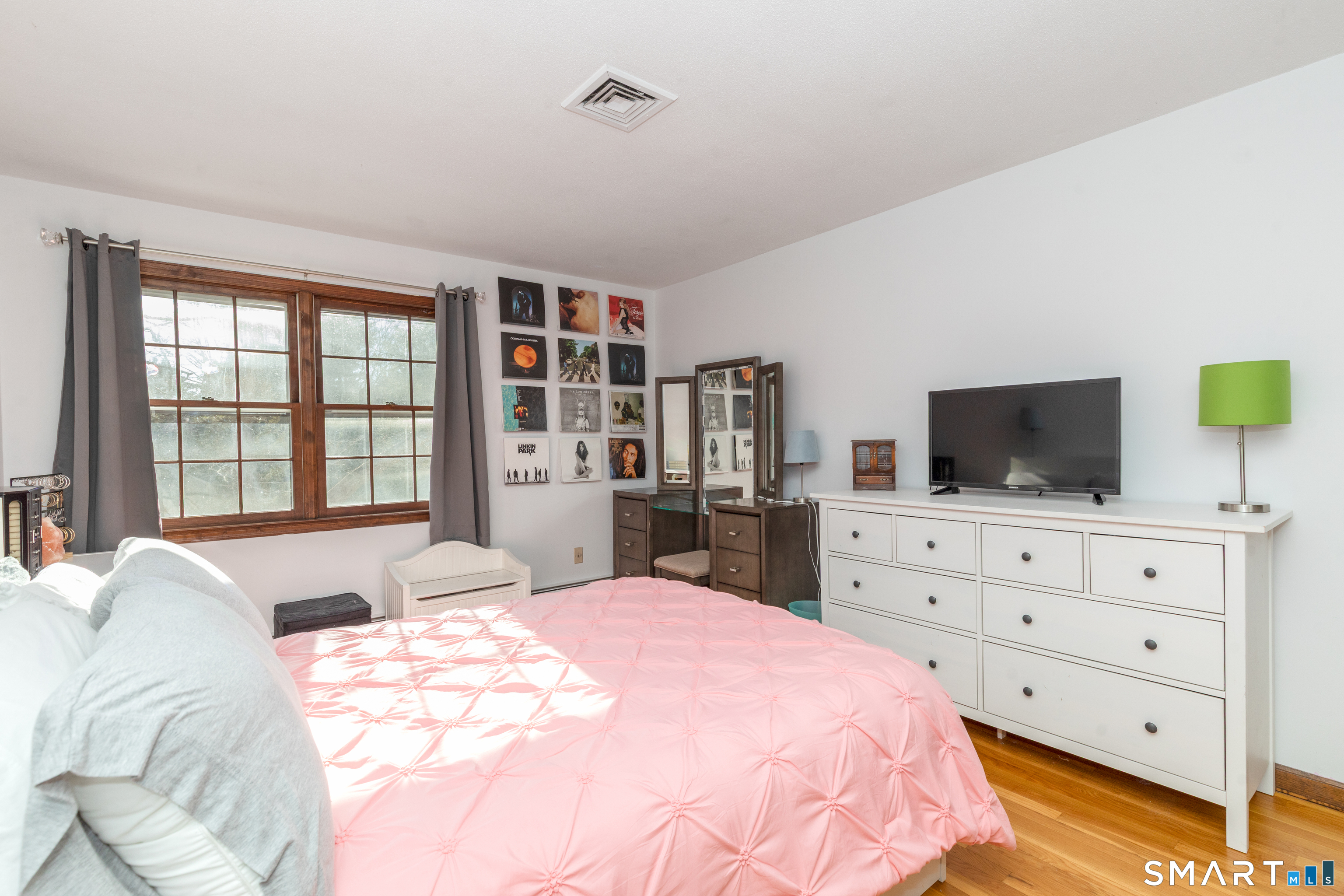 637 Watertown Road Middlebury, CT 06762 - Photo 19 of 40 a bedroom with a bed and flat screen tv