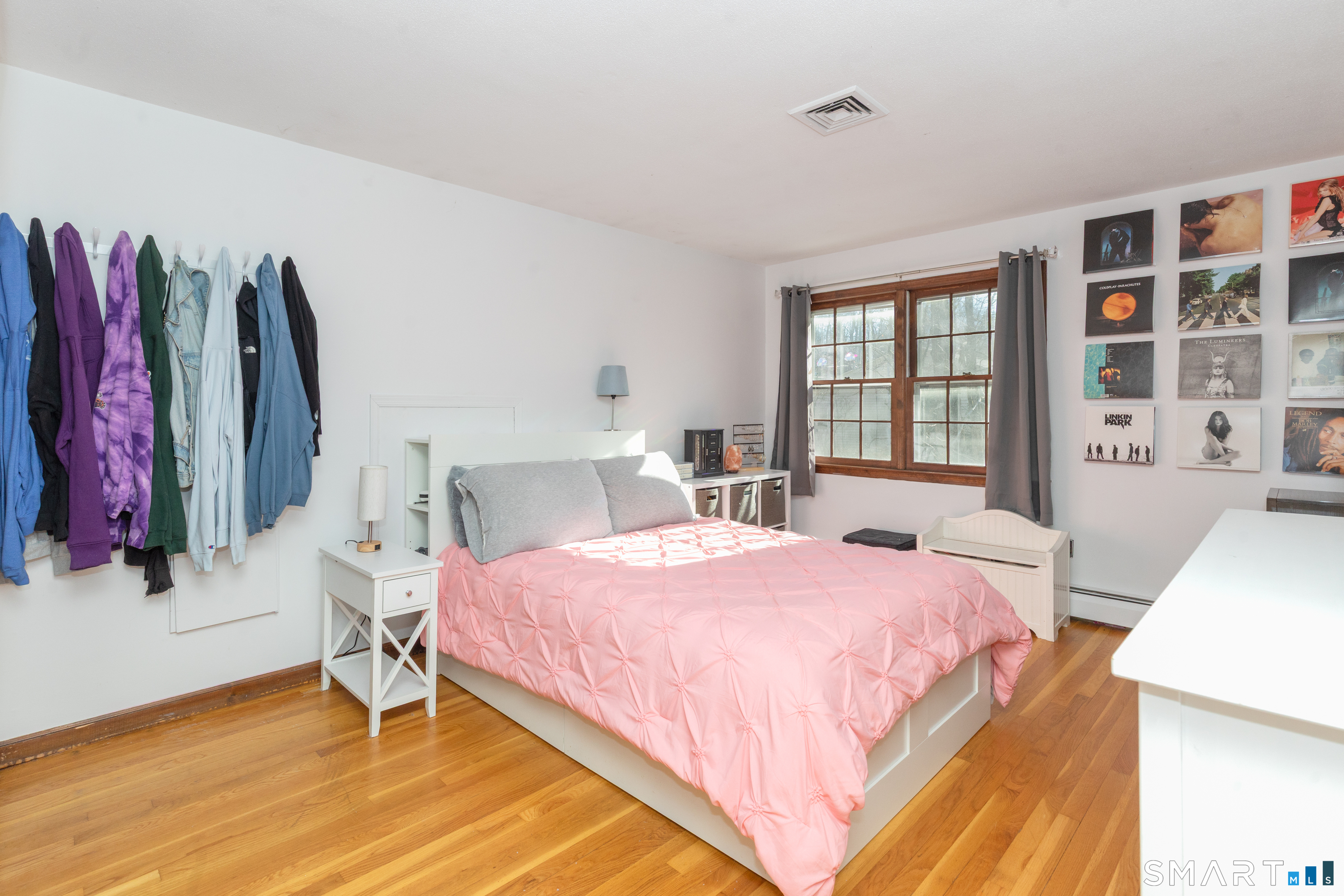 637 Watertown Road Middlebury, CT 06762 - Photo 20 of 40 a bedroom with a bed and a flat tv screen on dresser