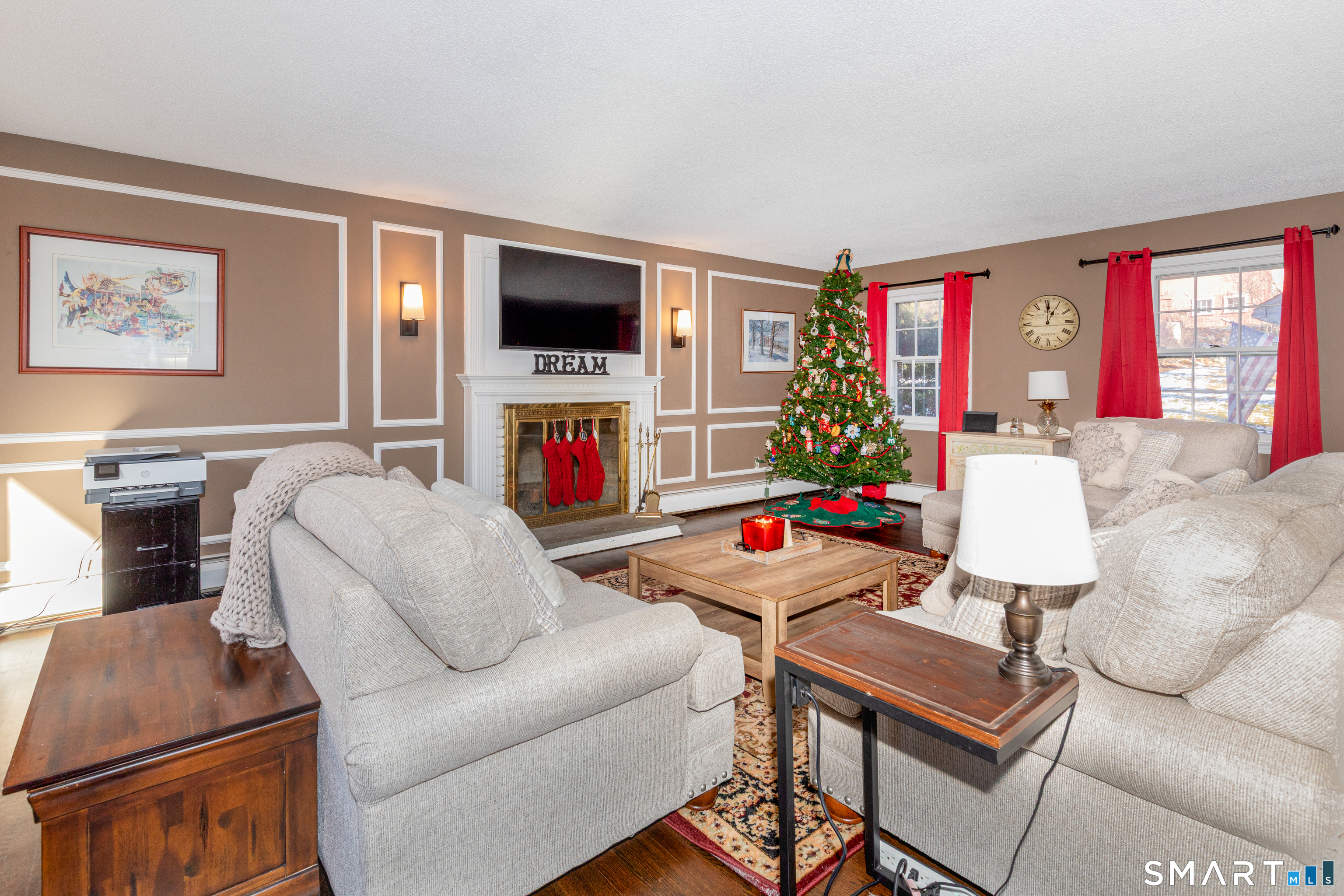 637 Watertown Road Middlebury, CT 06762 - Photo 4 of 40 a living room with furniture a flat screen tv and a fireplace