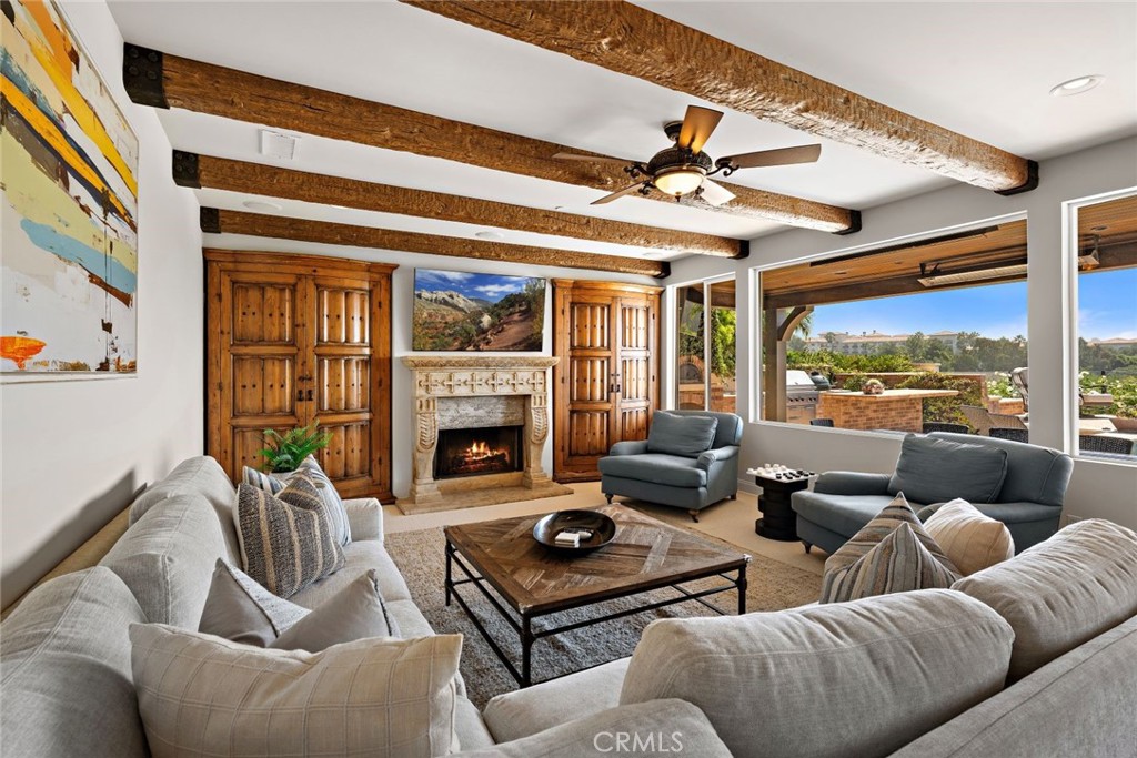 5 Via Monarca Street Dana Point, CA 92629 - Photo 4 of 64 a living room with furniture fireplace and a large window