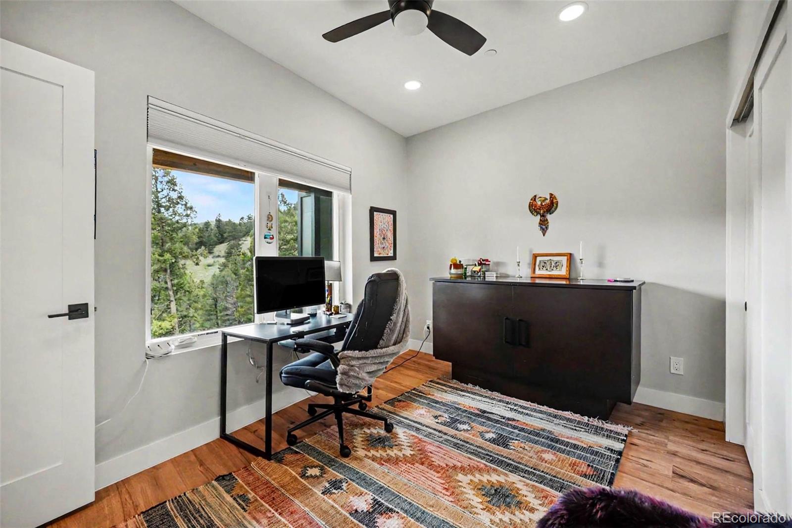 7231 Timber Trail Road Evergreen, CO 80439 - Photo 12 of 35 a workspace with furniture and a window