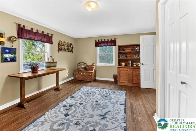 a bedroom that has a bed and a table in it