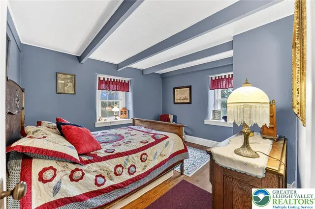 a bathroom with a sink a toilet and a large mirror