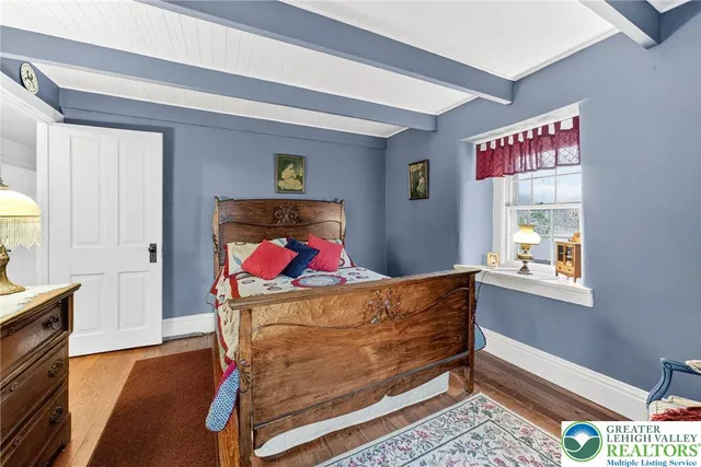 a view of a chairs and table in a balcony