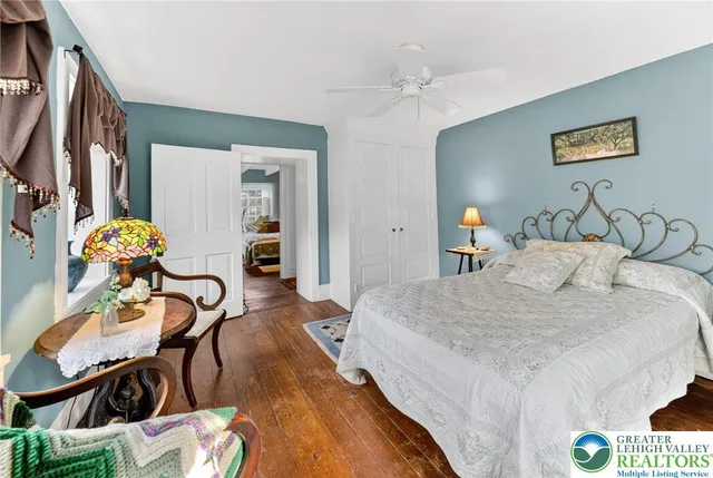 a view of a backyard with large trees