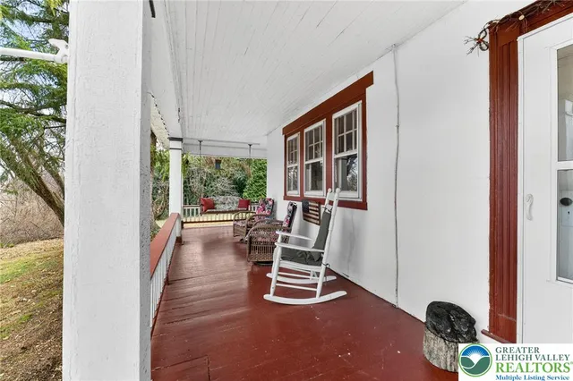 a view of a yard with large trees