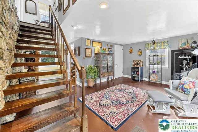 a view of entryway with wooden floor and front door