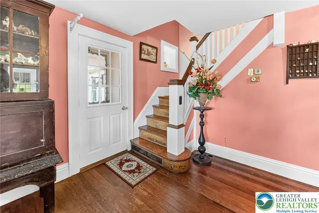 a kitchen with stainless steel appliances granite countertop a refrigerator a stove and a sink