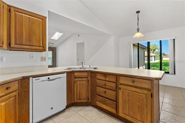 a kitchen with sink and cabinets