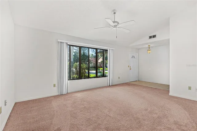 a view of an empty room with a window