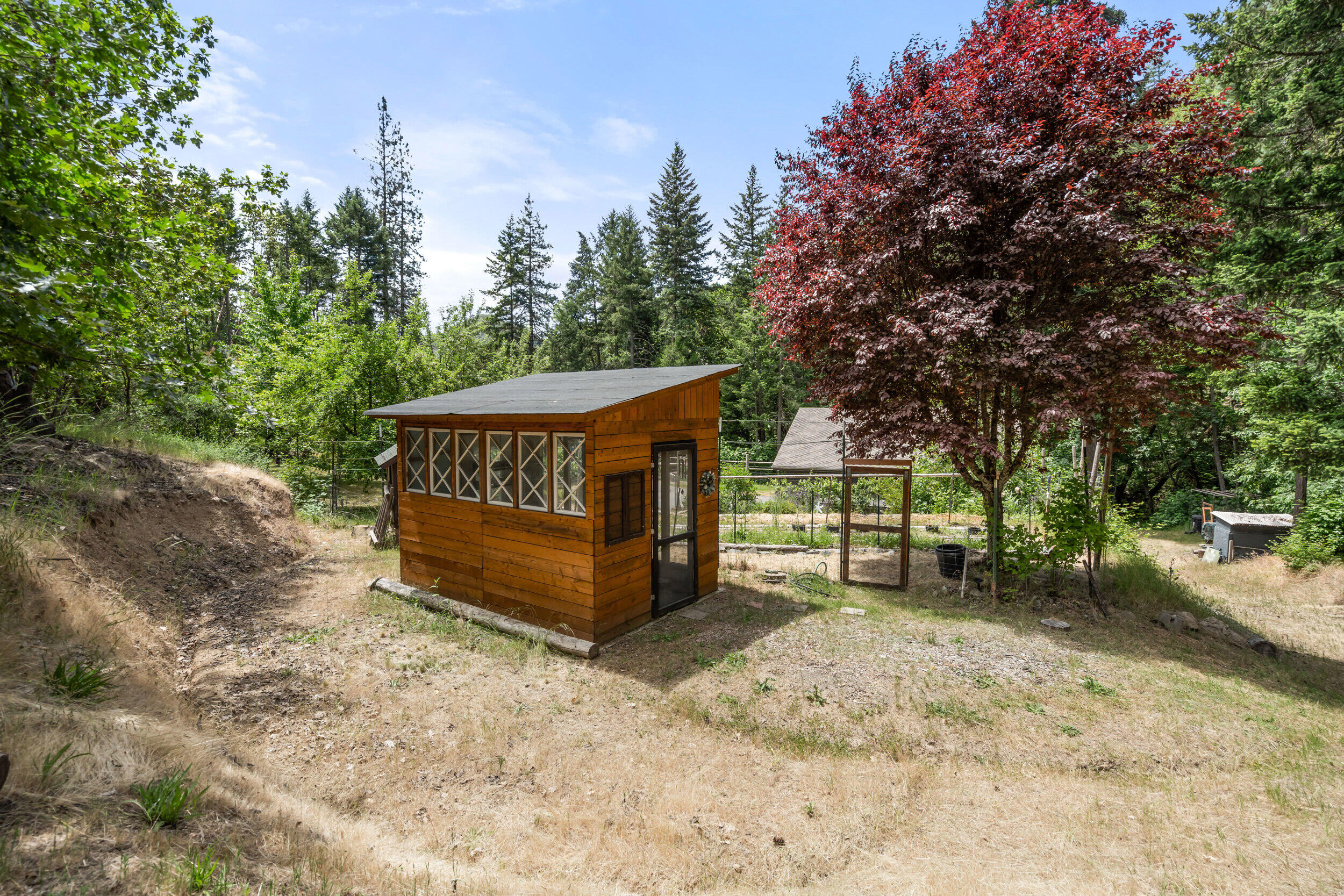 3268 Humbug Creek Road Jacksonville, OR 97530 - Photo 30 of 36 a view of a house with a yard