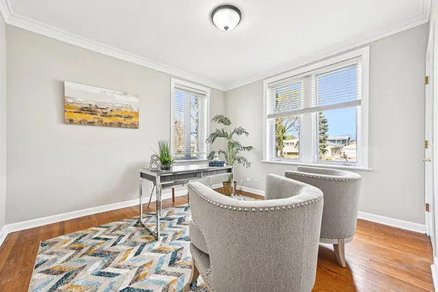 a view of an entryway with wooden floor and staircase
