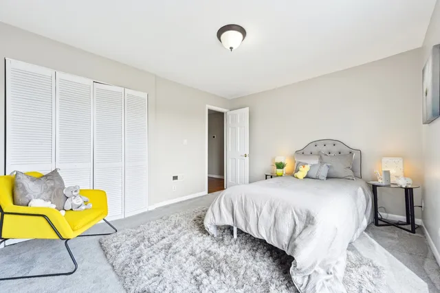 a view of livingroom with stairs and a ceiling fan