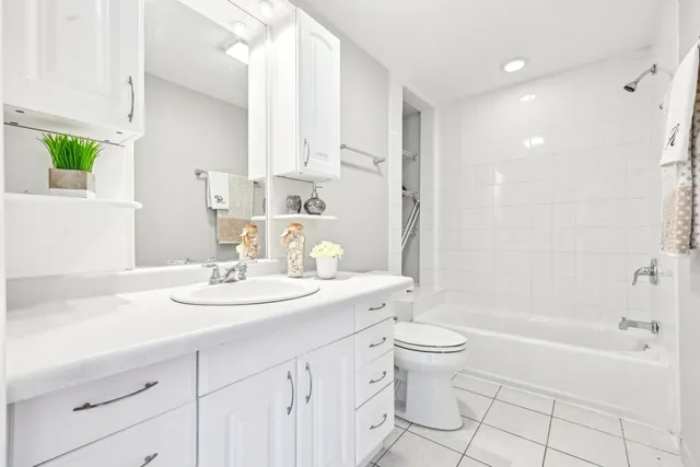 a spacious bedroom with a bed and a window