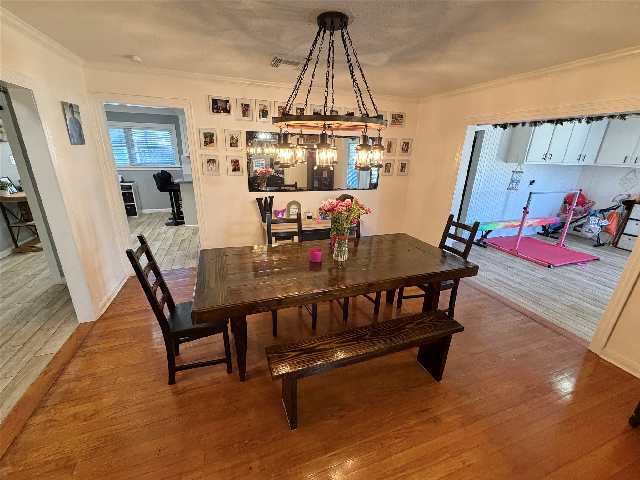 907 East Magnolia Street Angleton, TX 77515 - Photo 11 of 34 a view of a dining room with furniture and a chandelier