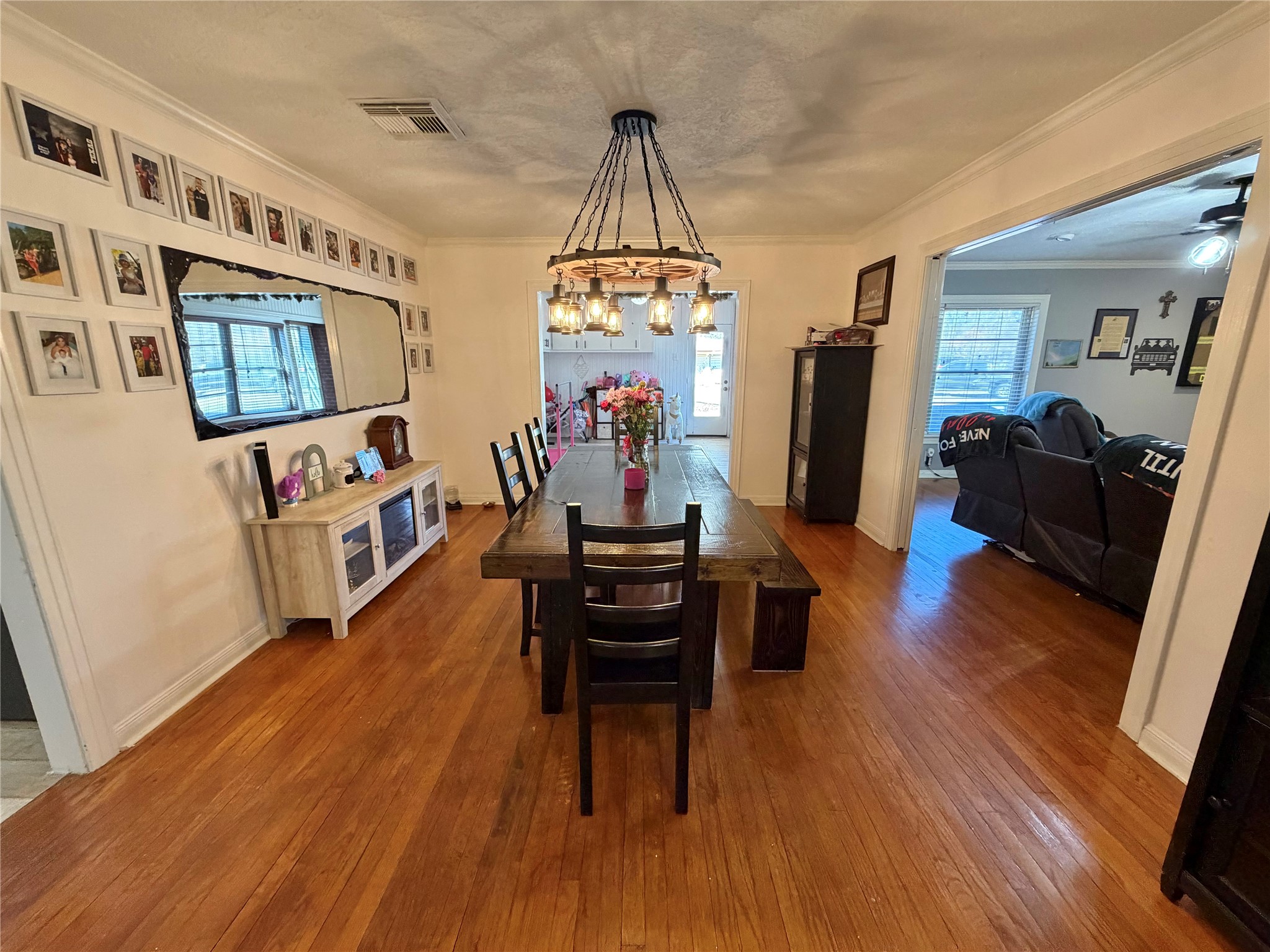 907 East Magnolia Street Angleton, TX 77515 - Photo 12 of 34 a living room with furniture and a wooden floor