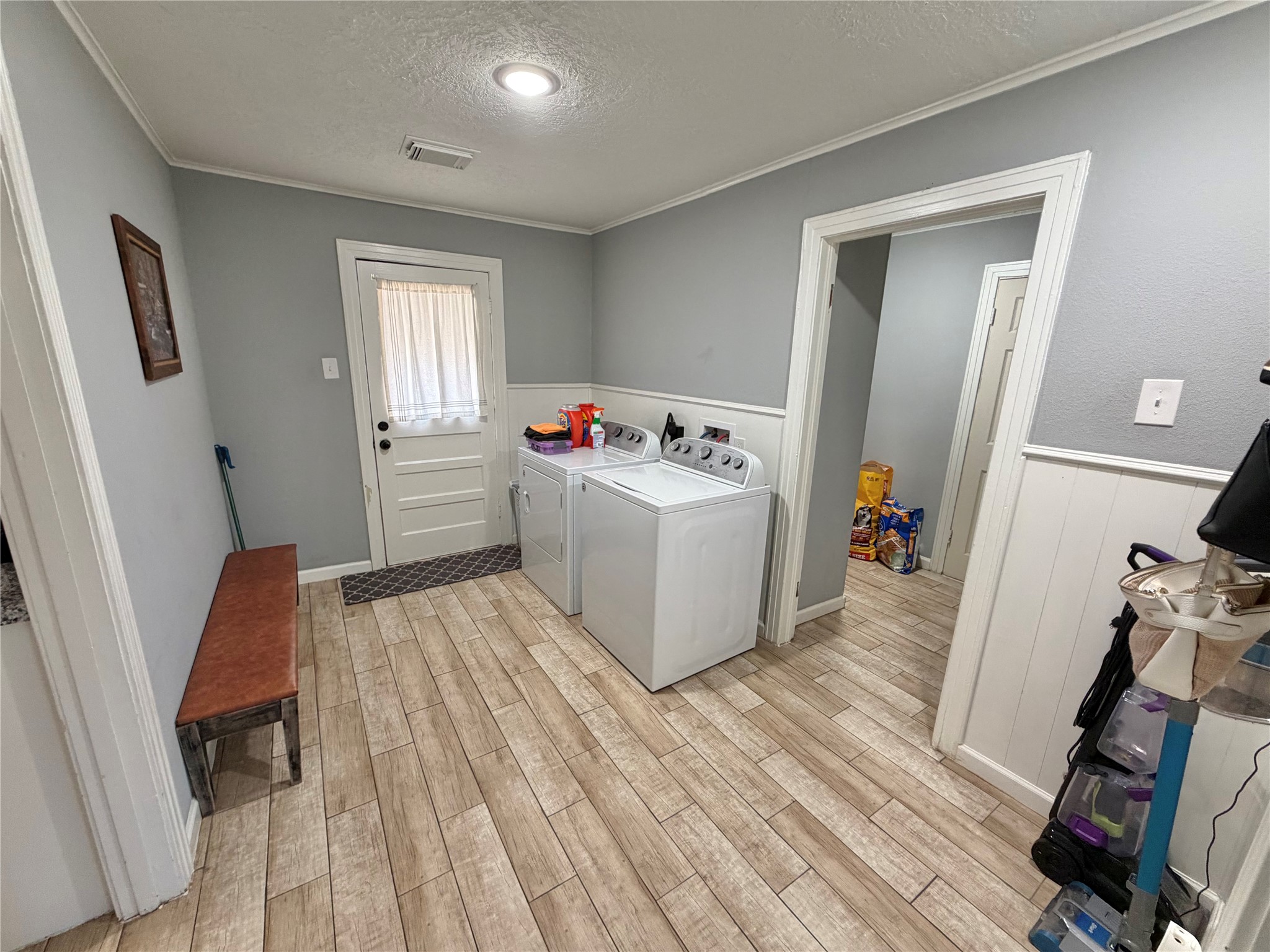 907 East Magnolia Street Angleton, TX 77515 - Photo 15 of 34 a view of a hardwood floor and a sink in a room