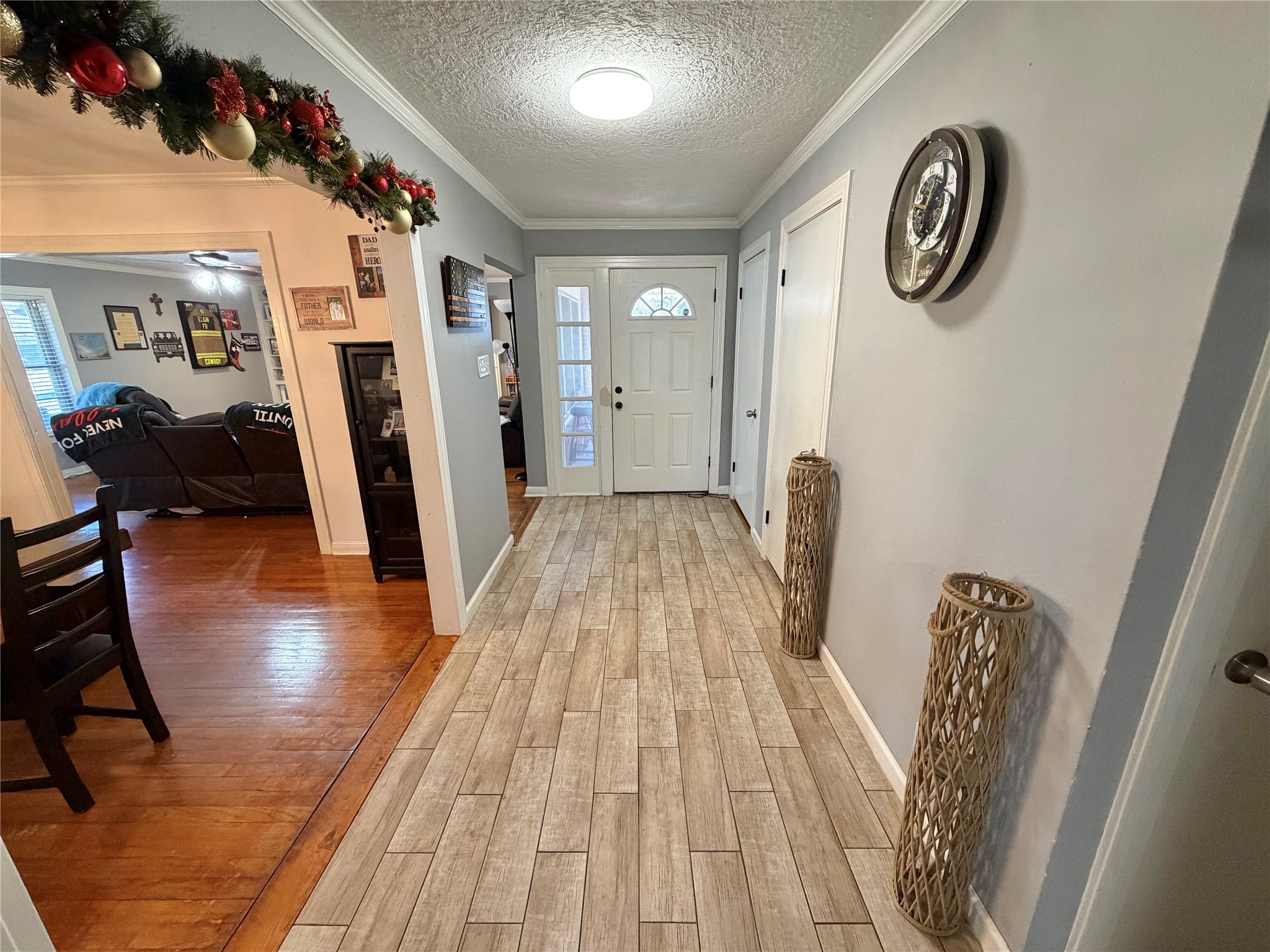 907 East Magnolia Street Angleton, TX 77515 - Photo 2 of 34 a view of a hallway with wooden floor and stairs