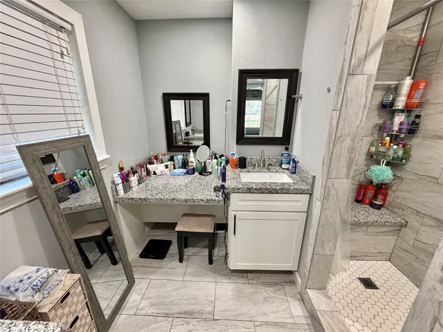 a dining room with a sink and a mirror