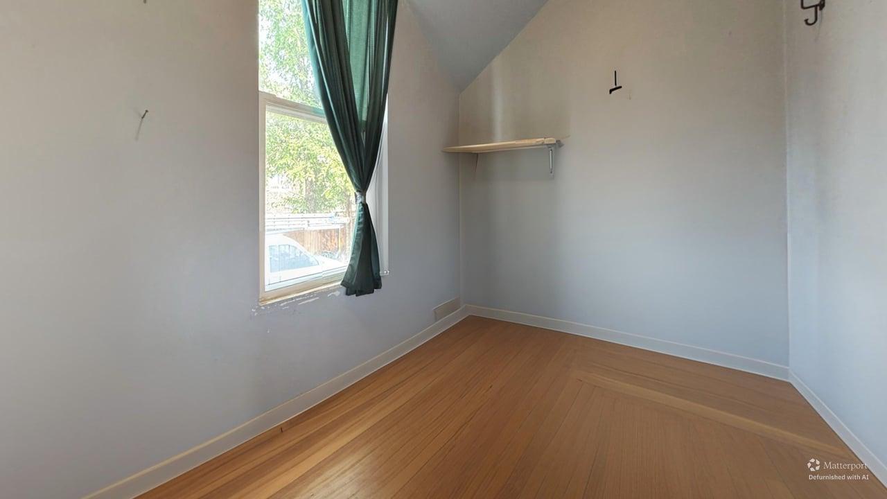1041 North Ridgeway Avenue Chicago, IL 60651 - Photo 14 of 33 an empty room with a window