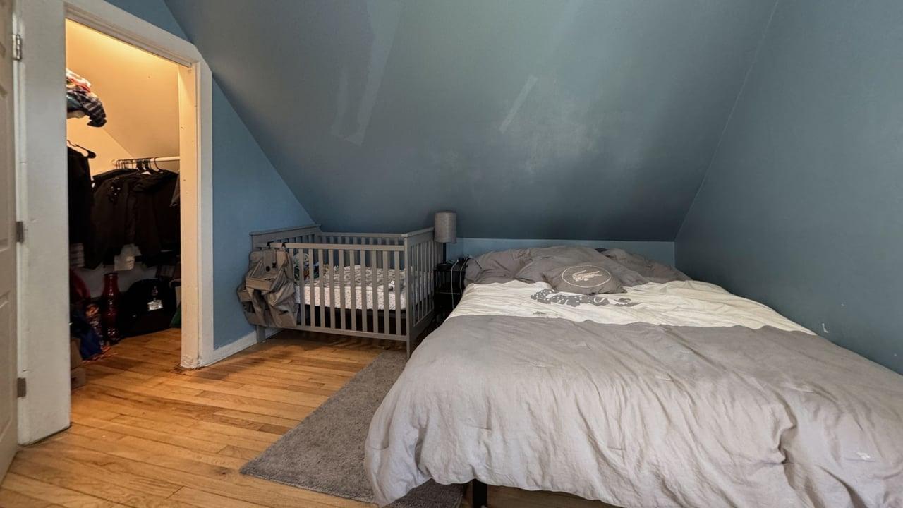 1041 North Ridgeway Avenue Chicago, IL 60651 - Photo 21 of 33 a bedroom with a bed and a window