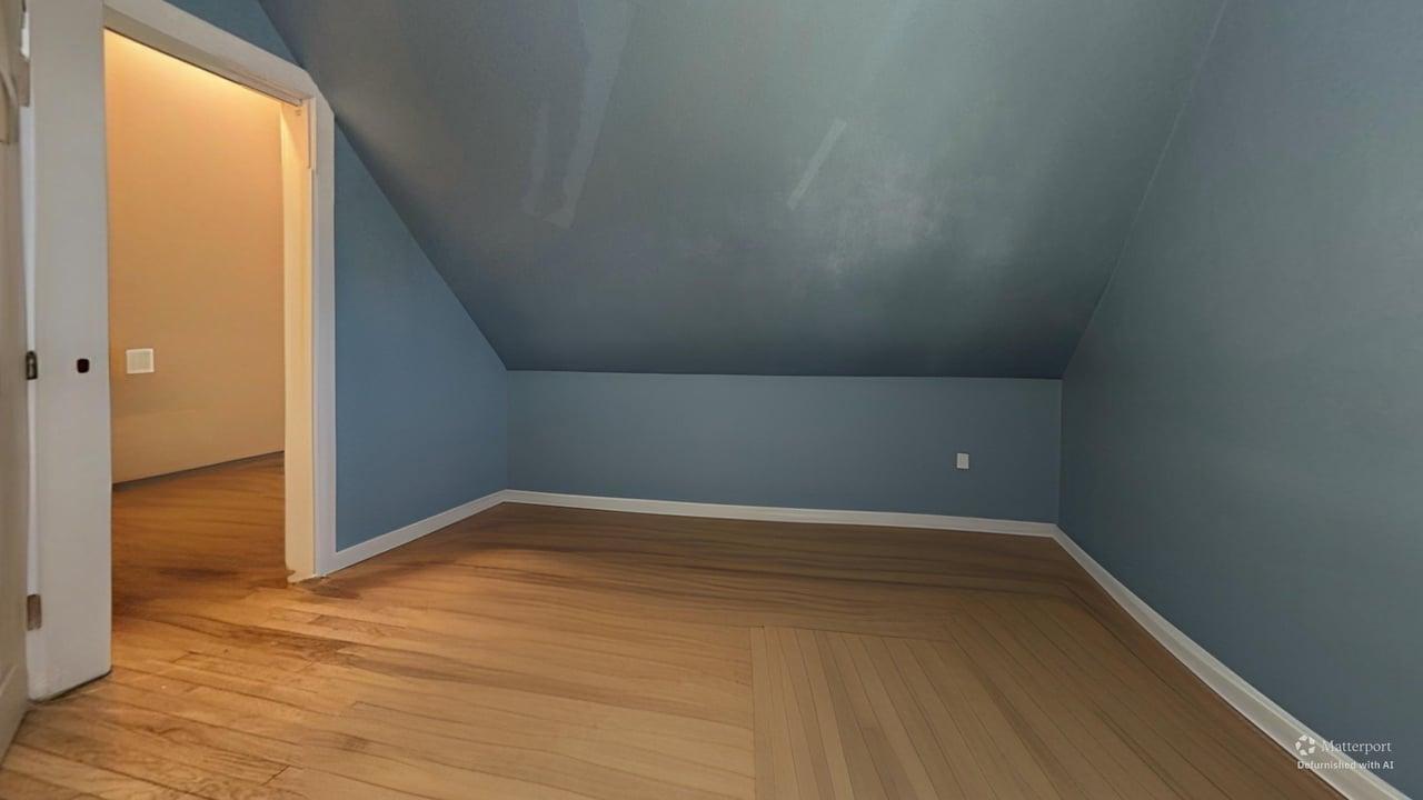 1041 North Ridgeway Avenue Chicago, IL 60651 - Photo 22 of 33 a view of an empty room with wooden floor
