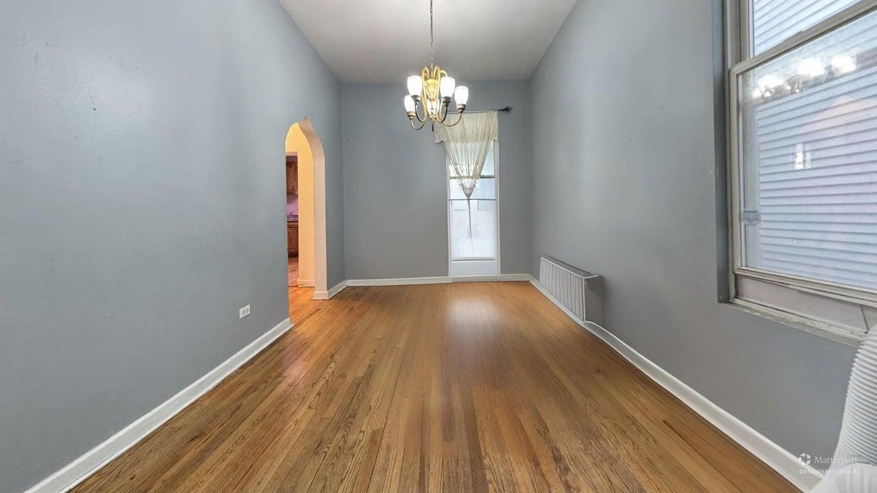 1041 North Ridgeway Avenue Chicago, IL 60651 - Photo 8 of 33 a view of entryway with wooden floor