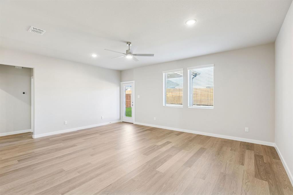 1156 Del Rio Drive Lavon, TX 75166 - Photo 15 of 35 wooden floor in an empty room with a window
